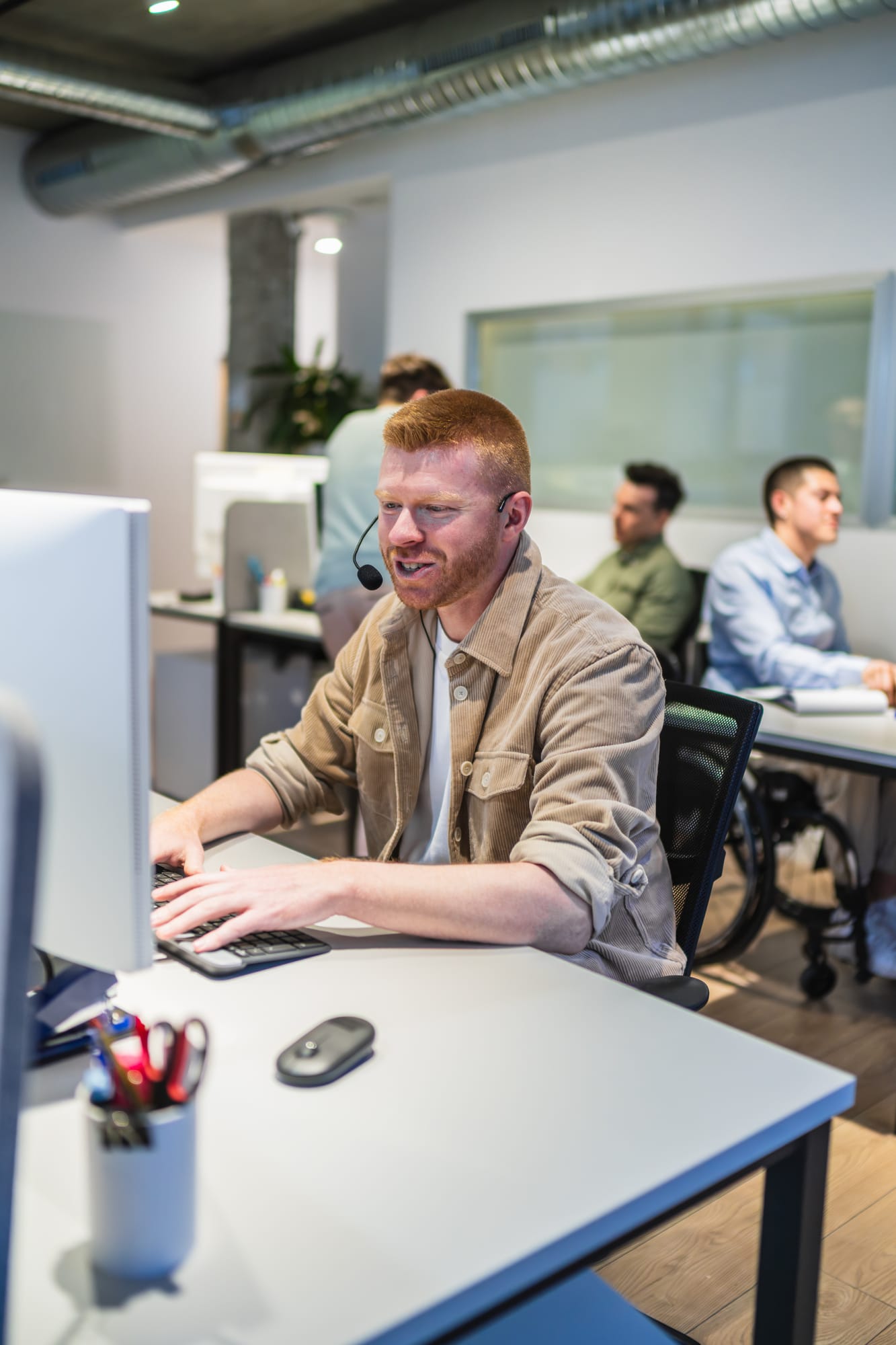 young-male-call-center-agent-working-on-computer-i-2025-10-27-12-59-31-utc.jpg