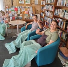 mums and bubs women in lounge with green towels.jpg