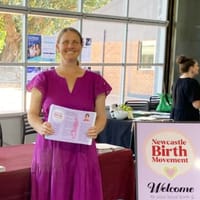 natalie at the wellness fair table.jpg
