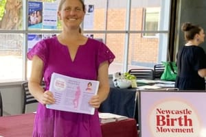 natalie at the wellness fair table.jpg