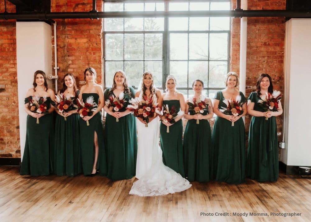 Bride and bridesmaids with custom sola wood wedding bouquets in burgundy, rust and ivory