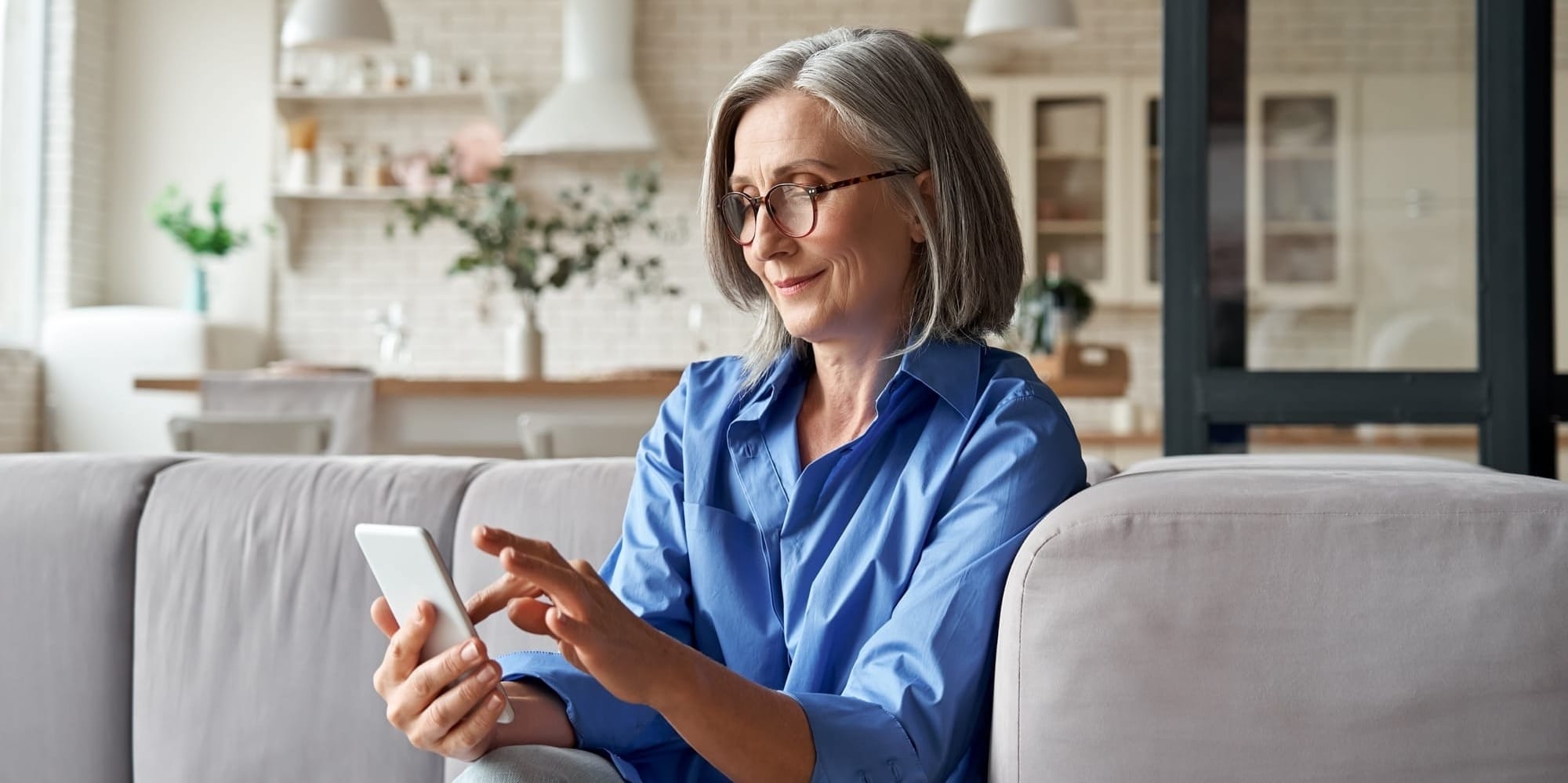 Woman in blue creating will on phone