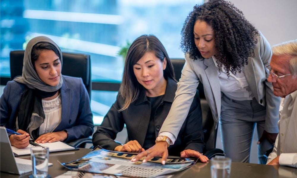 Employees having client discussion Fast Track Business Capital.jpg