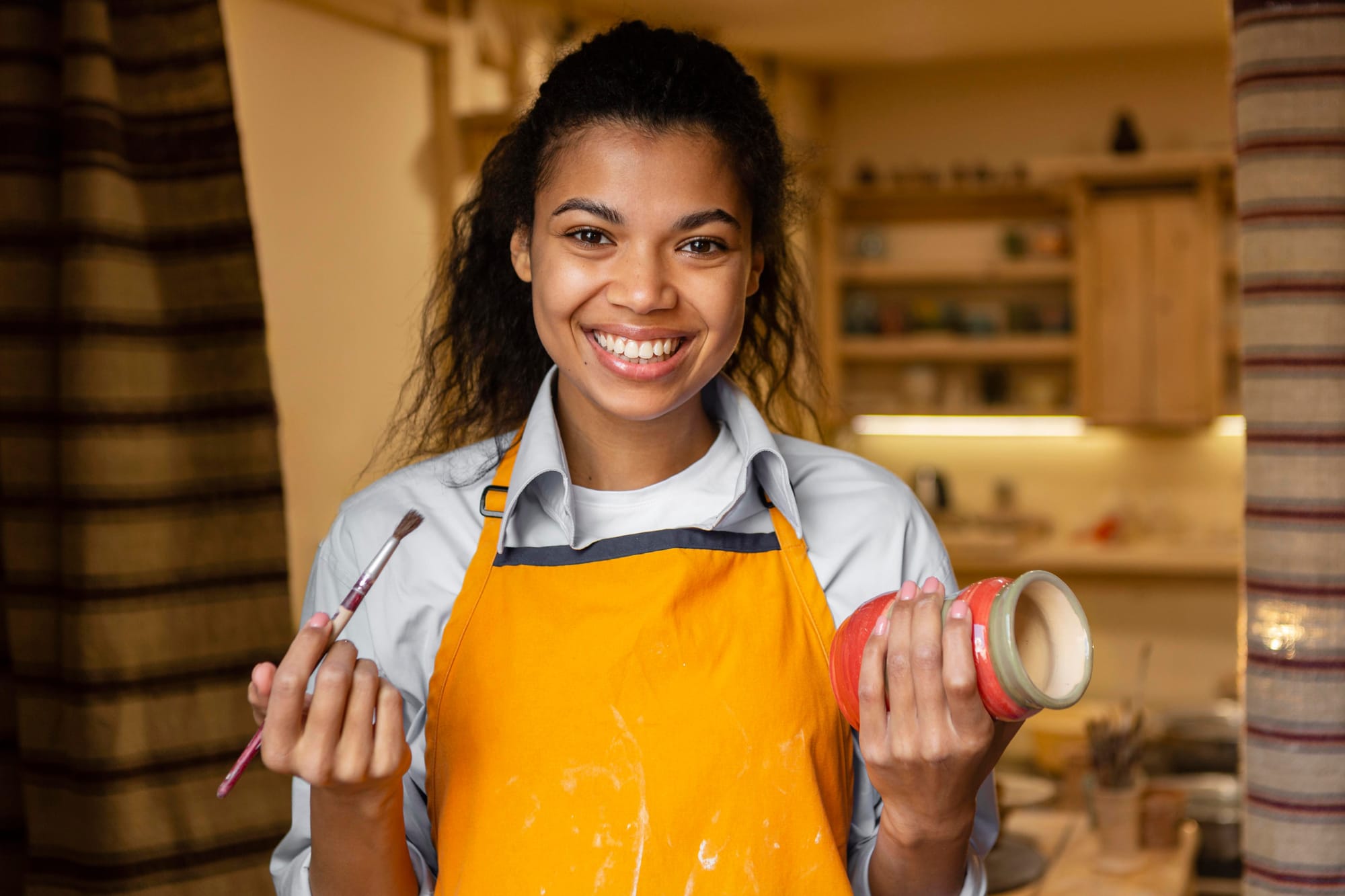 medium-shot-woman-holding-clay-pot.jpg